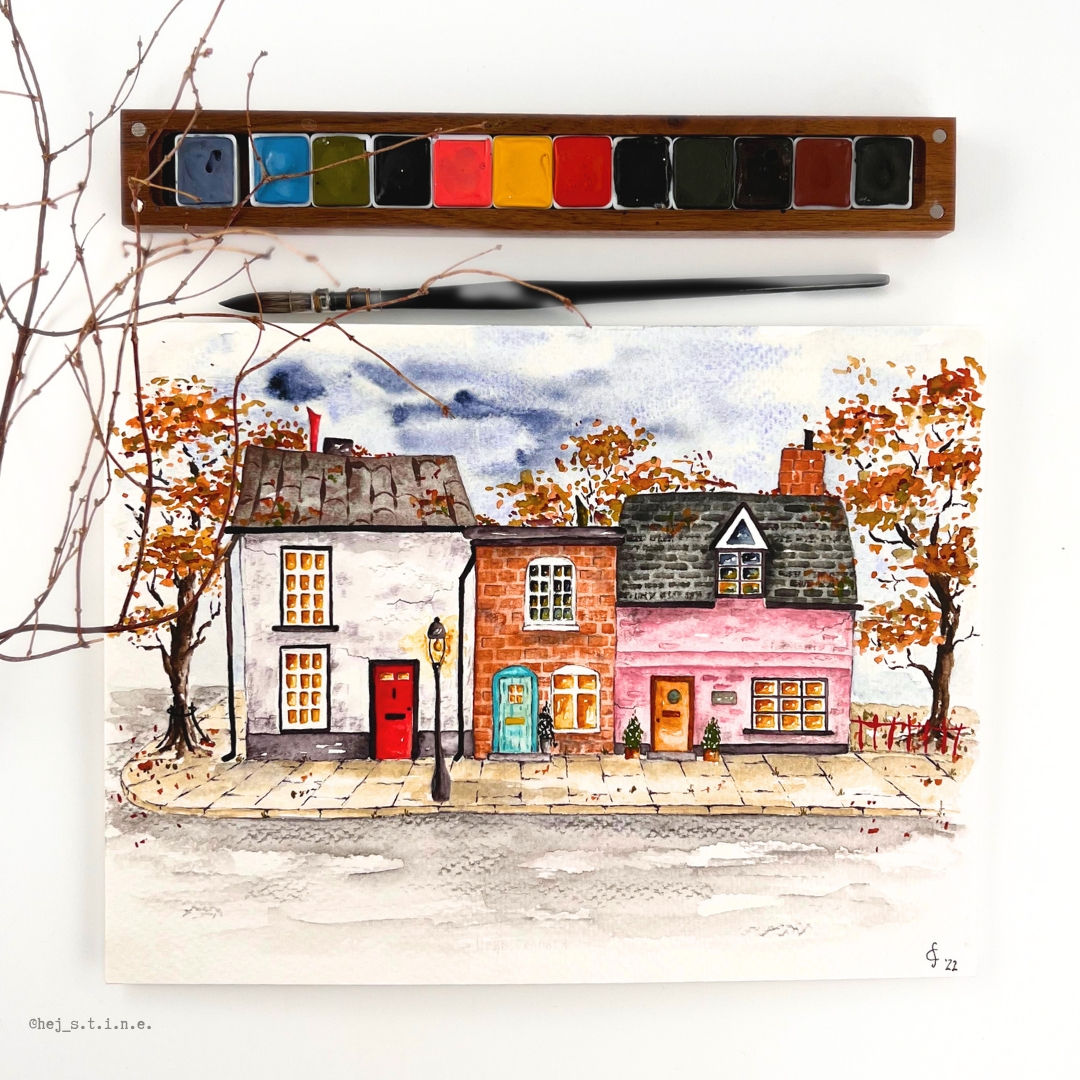 Aquarellbild mit kleinen englischen Häusern und herbstlichen Bäumen