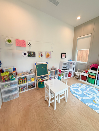 Organized children's playroom with toys and art