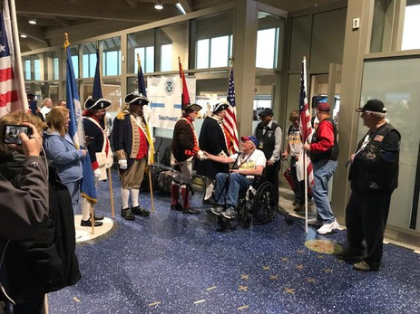 Greeting Veterans returning from Washington DC