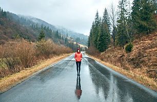 Girl Standing in Mountain Highway