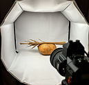 an image of documenting one old farming object inside of a newer photography lighting box
