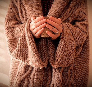 Hygge Hands with a warm cup of coffee an