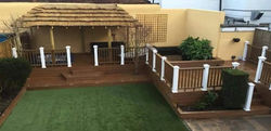 Composite deck with a pond and a hottub