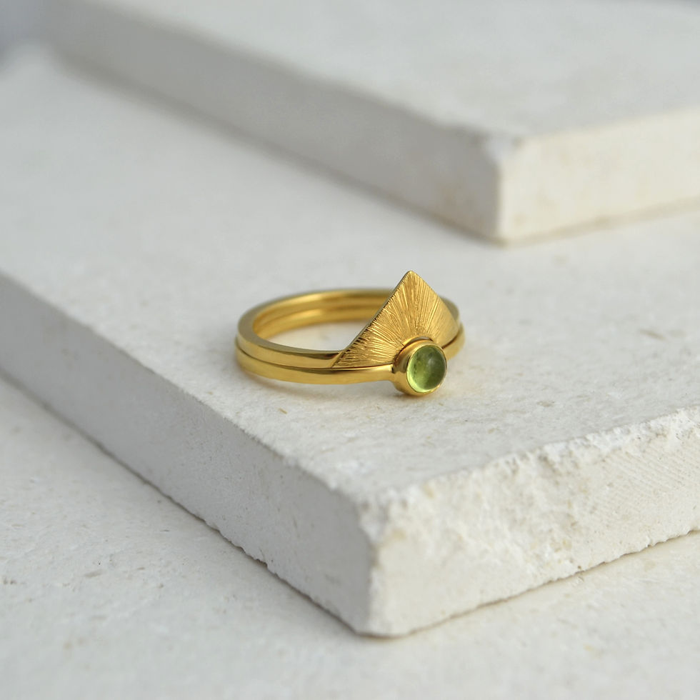 sun inspired stacking rings with sunbeam engraving and gemstone