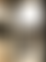 Woman swimming in pool at sunset; enjoying golden hour ambiance.