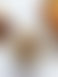 Close-up of olives around a bowl of tapenade and other food