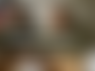 Two service members complete VA Form 21-10210 for a buddy statement VA at a desk, with U.S. flag and “EVIDENCE” folder visible.