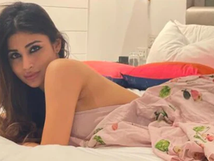 Mouni Roy spends her Saturday in bed in easy breezy halter dress
