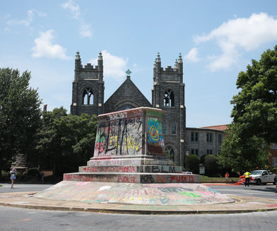 The pedestal that once held the JEB Stuart monument now sits empty, covered in graffiti. 