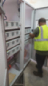 Technician working on electrical cabinet