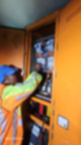 Worker inspecting electrical panel