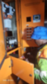 Technician working on electrical panel