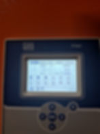 Control panel screen displaying output power and voltage
