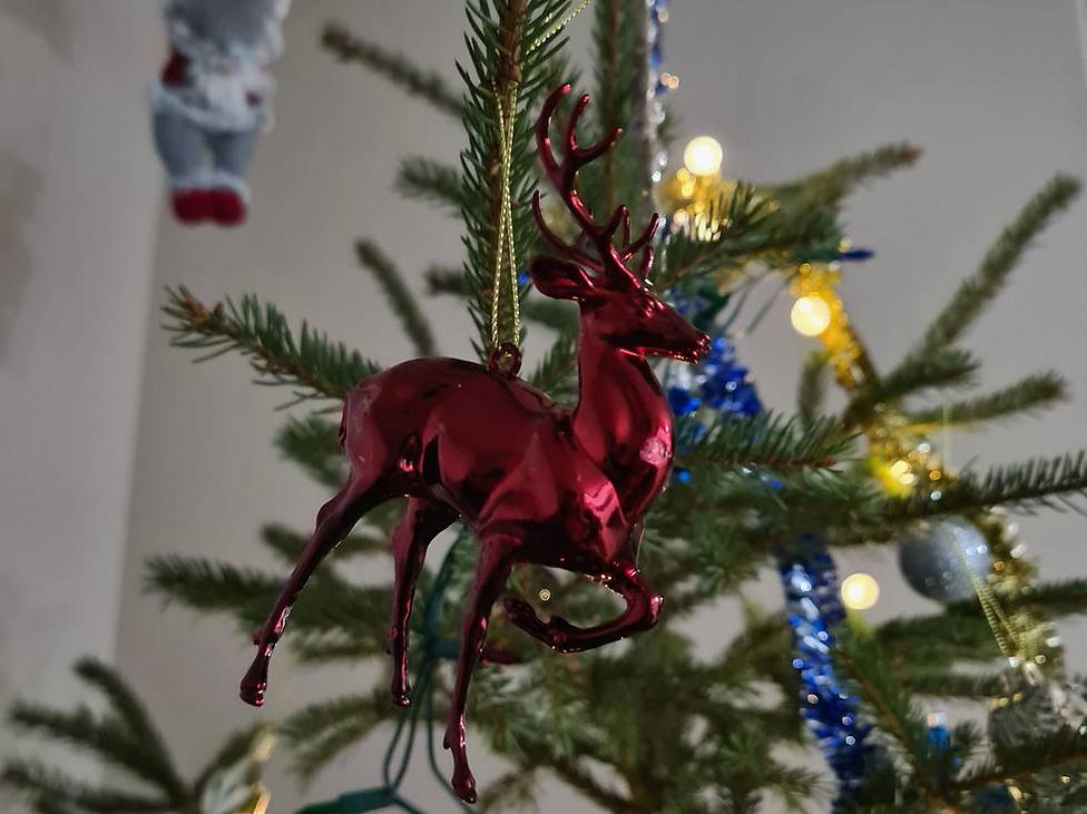 Red deer toy on the Christmas tree
