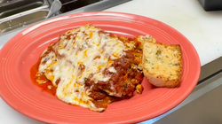 Homemade eggplant Parmesan with marinara sauce and melted mozzarella cheese