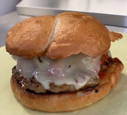 Swiss Burger with melted Swiss cheese at Tollhouse Market and Grill