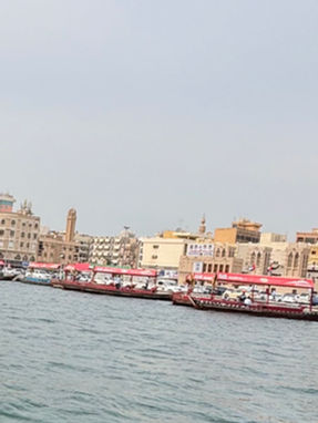 Traditional abras and old waterfront buildings in Deira, Dubai