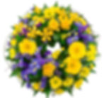 Wreath of seasonal yellow and purple flowers