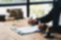 businessman-in-suit-or-lawyer-working-on-a-documents-legal-law.jpg