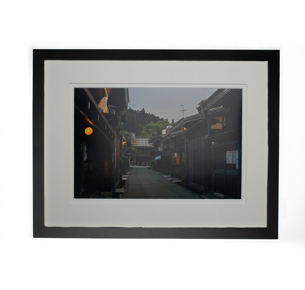An artistic wall art print of old town Japan in the evening with a black frame