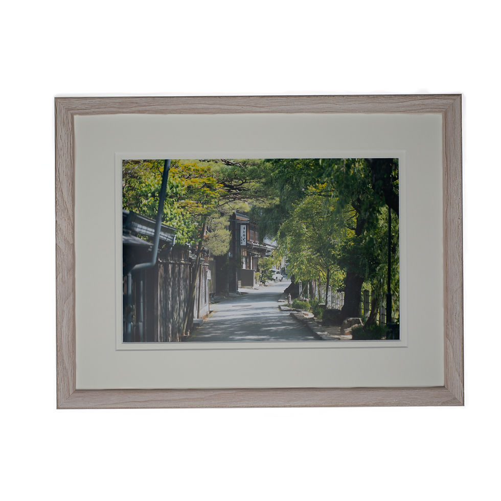 A artistically photographed wall art print of a mini minor in the streets for old town japan in a wood taupe frame