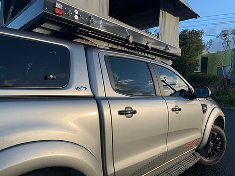 Ranger Ford side back view drivers side rack and Bundutop.jpg
