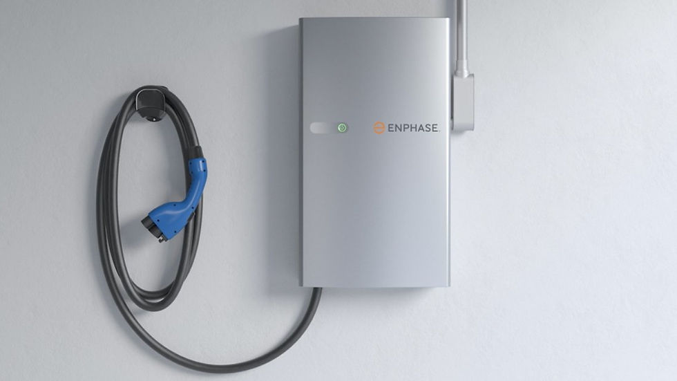 Eye-level view of an electrician installing an EV charger on a residential wall