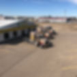 Top view of three trucks parked outside