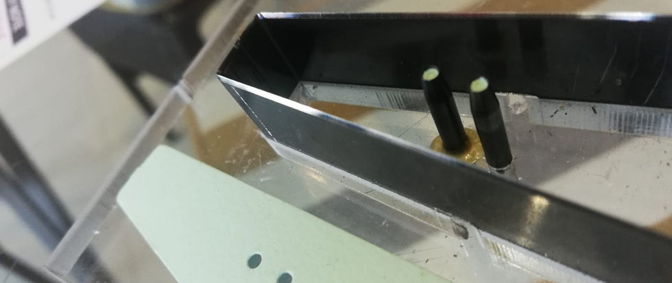 Precision cutting knife for leather handbag manufacturing, shown in close-up.