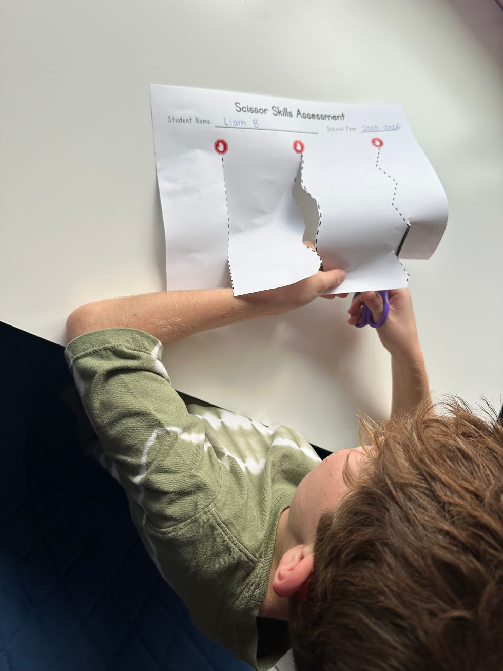 student completing a cutting assessment