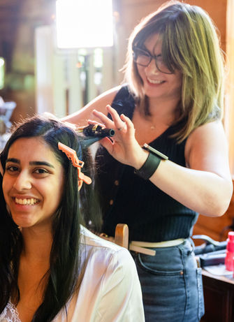 Destination bride receiving updo at Townsend wedding venue by Rvl'd Beauty.