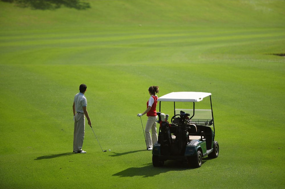 man and women at a golf course