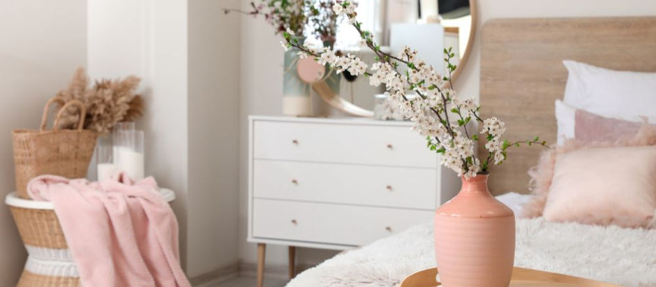 bedroom with pink and natural wood colors