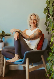 image of woman studio owner sitting in chair