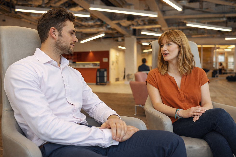 Office conversation in modern workspace.png
