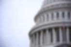 Side view of a federal capital building with american flag