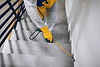 Manual worker in protective work wear spraying virus and bacteria disinfection in resident