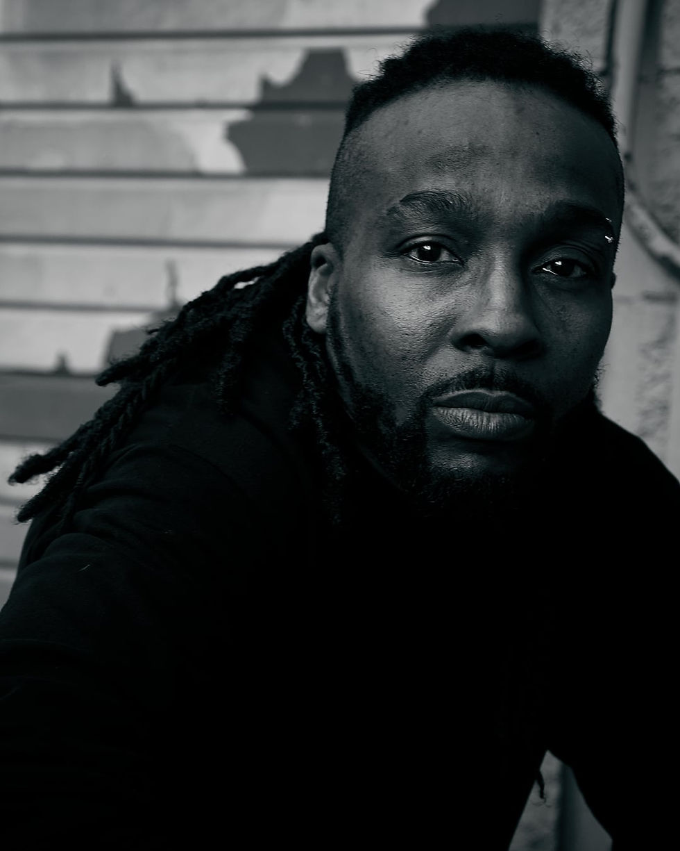 Calgary hip hop and dancehall artist Mason Xross posing for a promotional photo, representing Canadian talent with a bold, confident style.