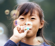 Girl Blowing Bubbles