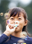 Girl Blowing Bubbles