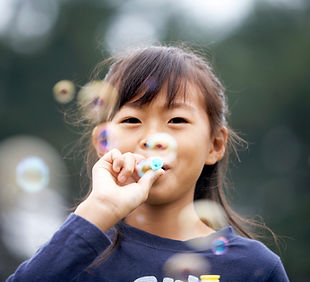 Girl Blowing Bubbles
