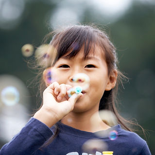 Girl Blowing Bubbles