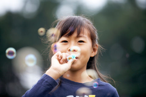Girl Blowing Bubbles