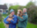 Guy and Ruby holding dogs