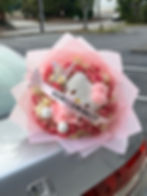 Pink and white roses with a Hello Kitty Plushie Homecoming bouquet 