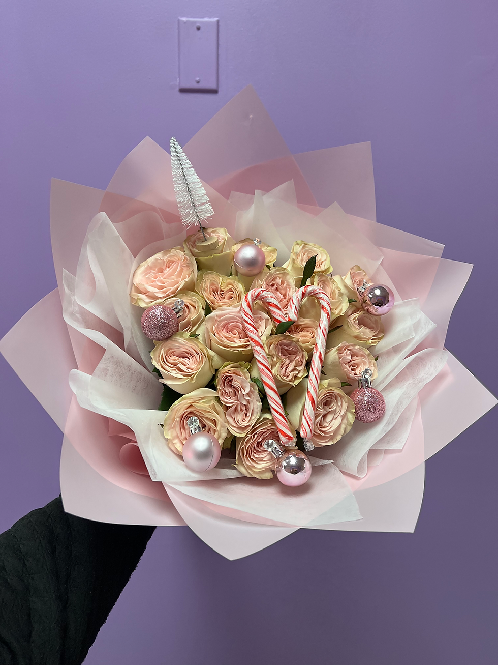 Candy Cane's and pink & White Roses surrounded by pink bouquet paper
