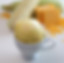 Scoop of mais con queso ice cream with fresh corn in the cob and cheese slices