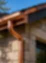 Custom copper seamless rain gutters installed on a luxury Southern California home
