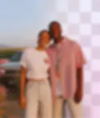 A smiling couple stands outdoors. Half of the background is replaced by a transparent checkerboard pattern to show the background removal tool.