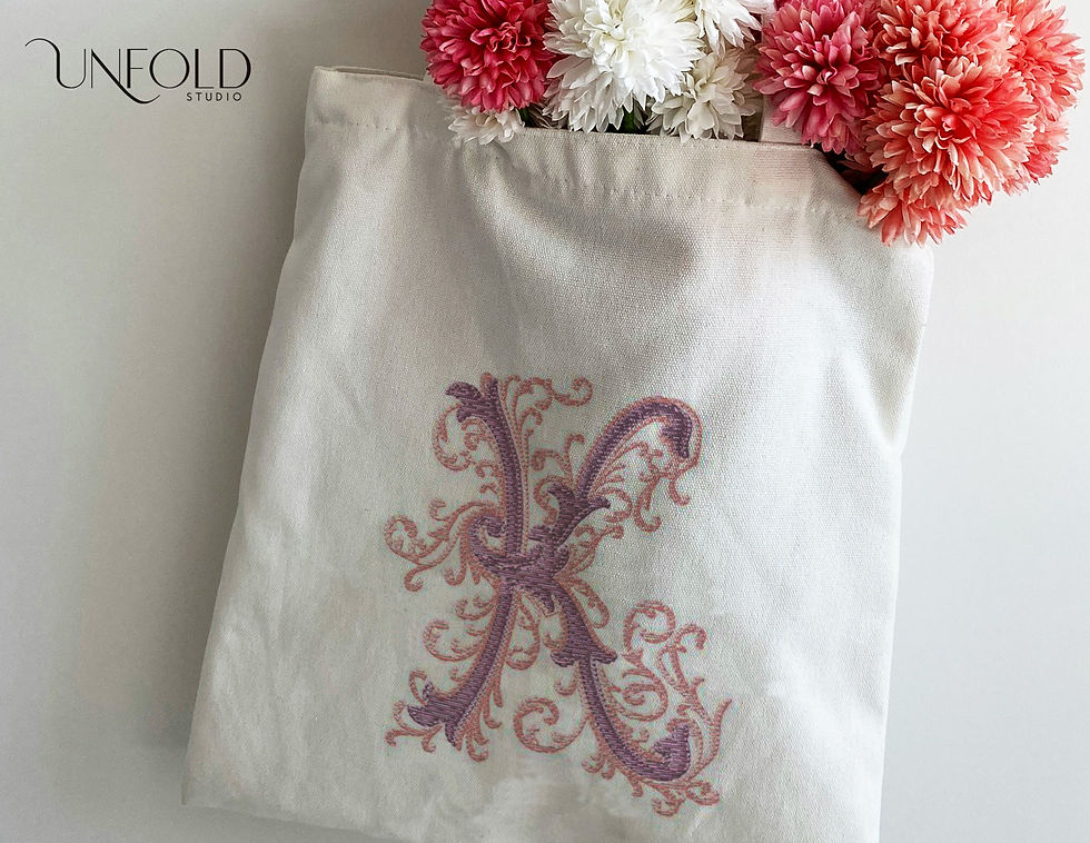 Thumbnail: Embroidered-style decorative letter K with elaborate swirls and scrolls, featuring intricate, flowing designs.
